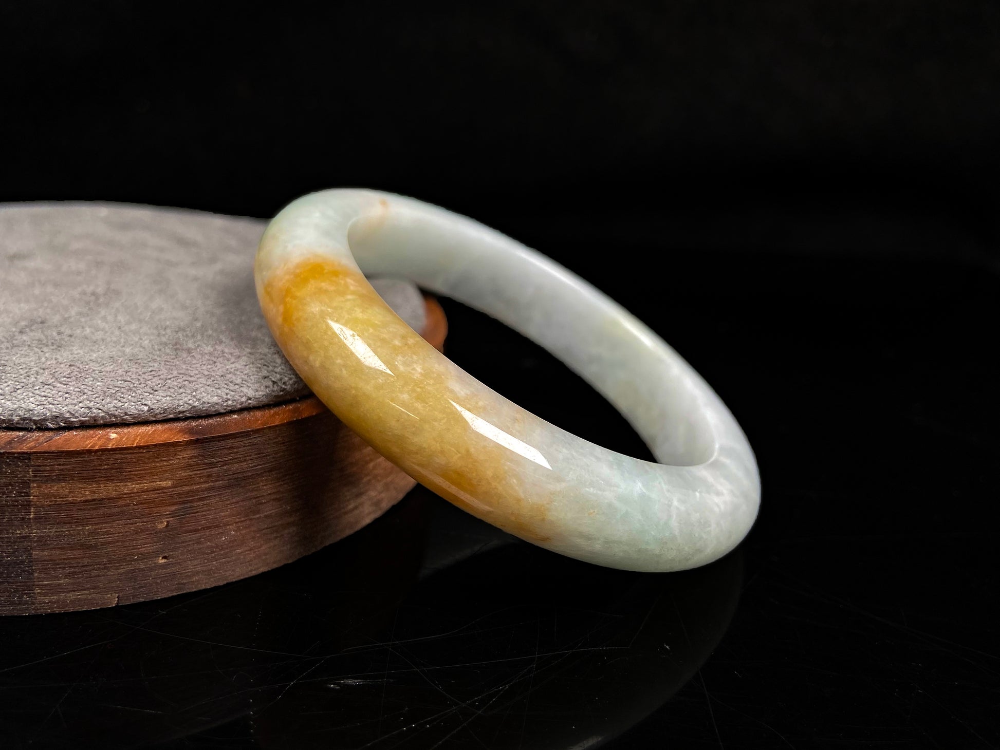 A light fernery gilded mist jadeite bangle.