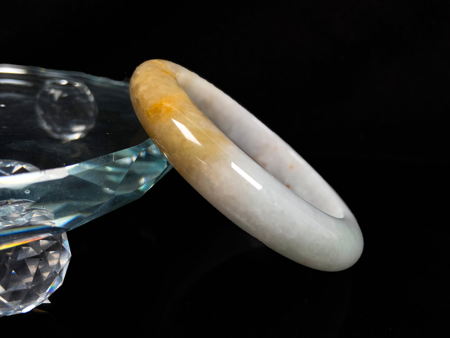 A creamy white with green and honey yellow  jadeite bangle.