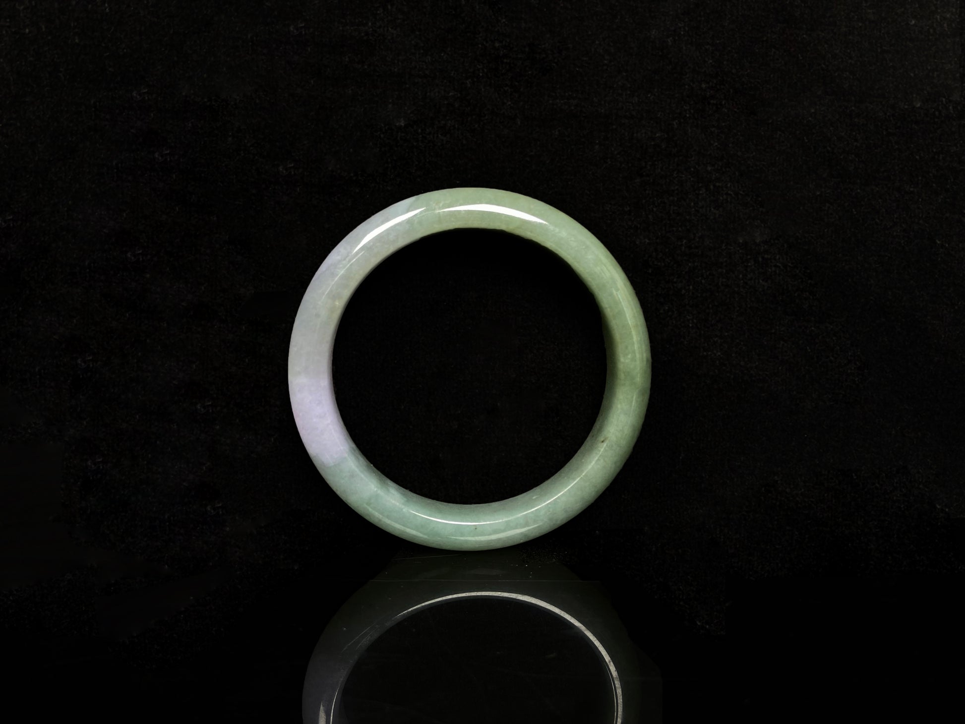 A misty sage base with wispy frosted white veins jadeite bangle.
