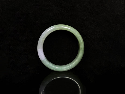 A misty sage base with wispy frosted white veins jadeite bangle.