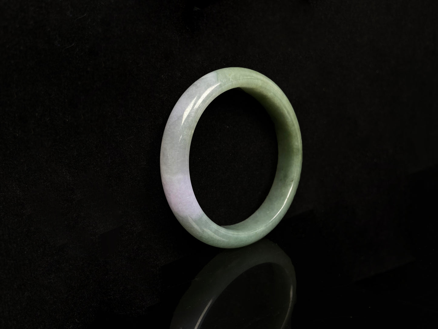 A misty sage base with wispy frosted white veins jadeite bangle.