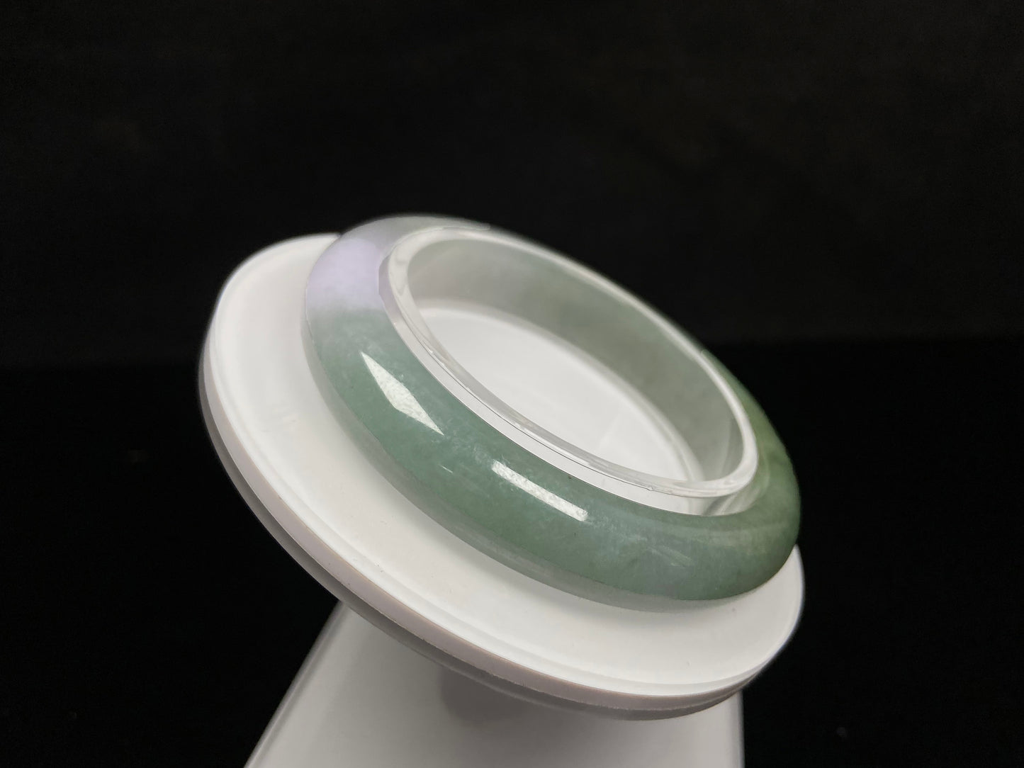 A misty sage base with wispy frosted white veins jadeite bangle.