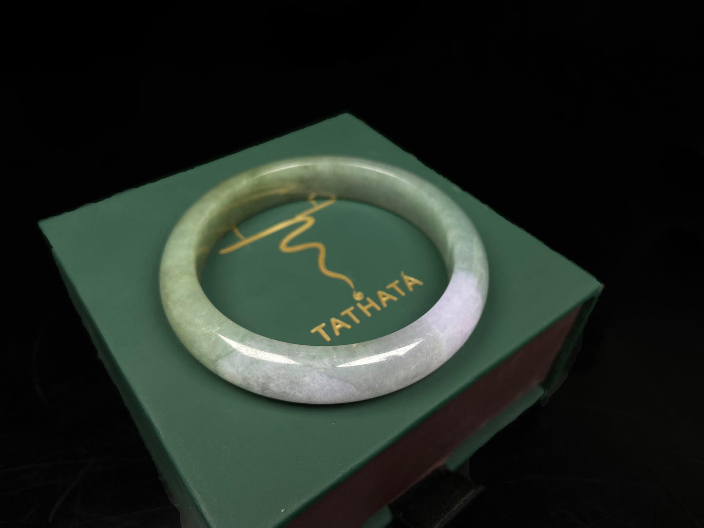 A misty sage base with wispy frosted white veins jadeite bangle.