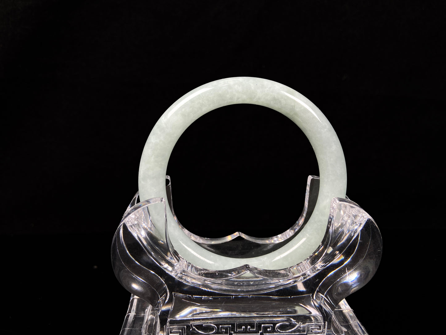 A dewy green jadeite bangle. 