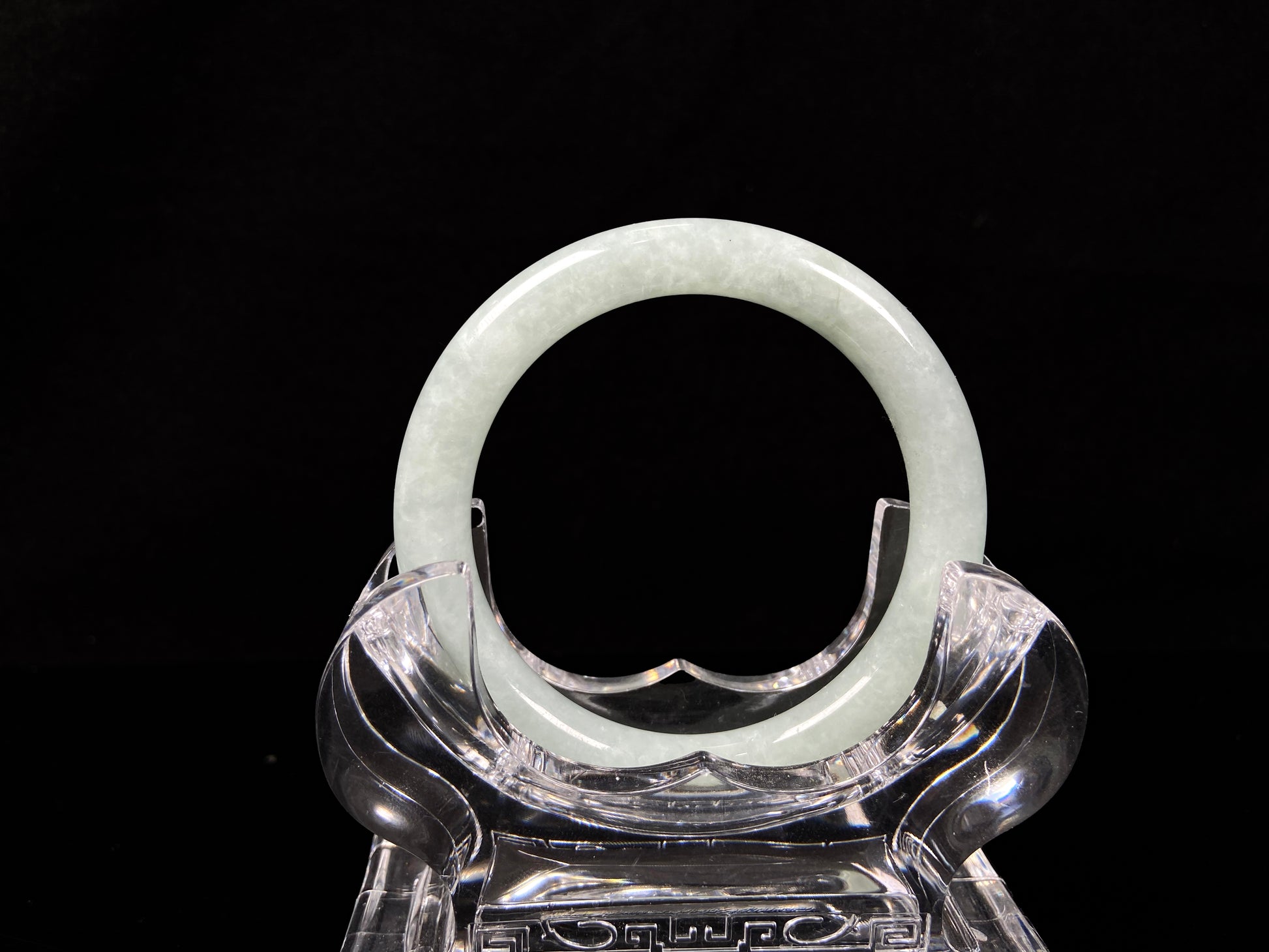 A dewy green jadeite bangle. 