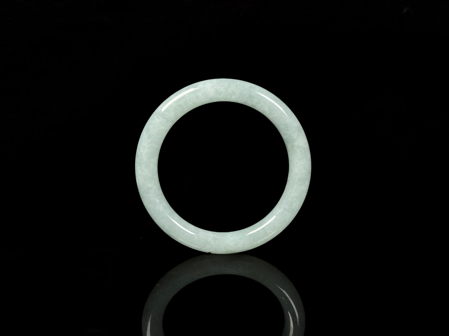 A dewy green jadeite bangle.