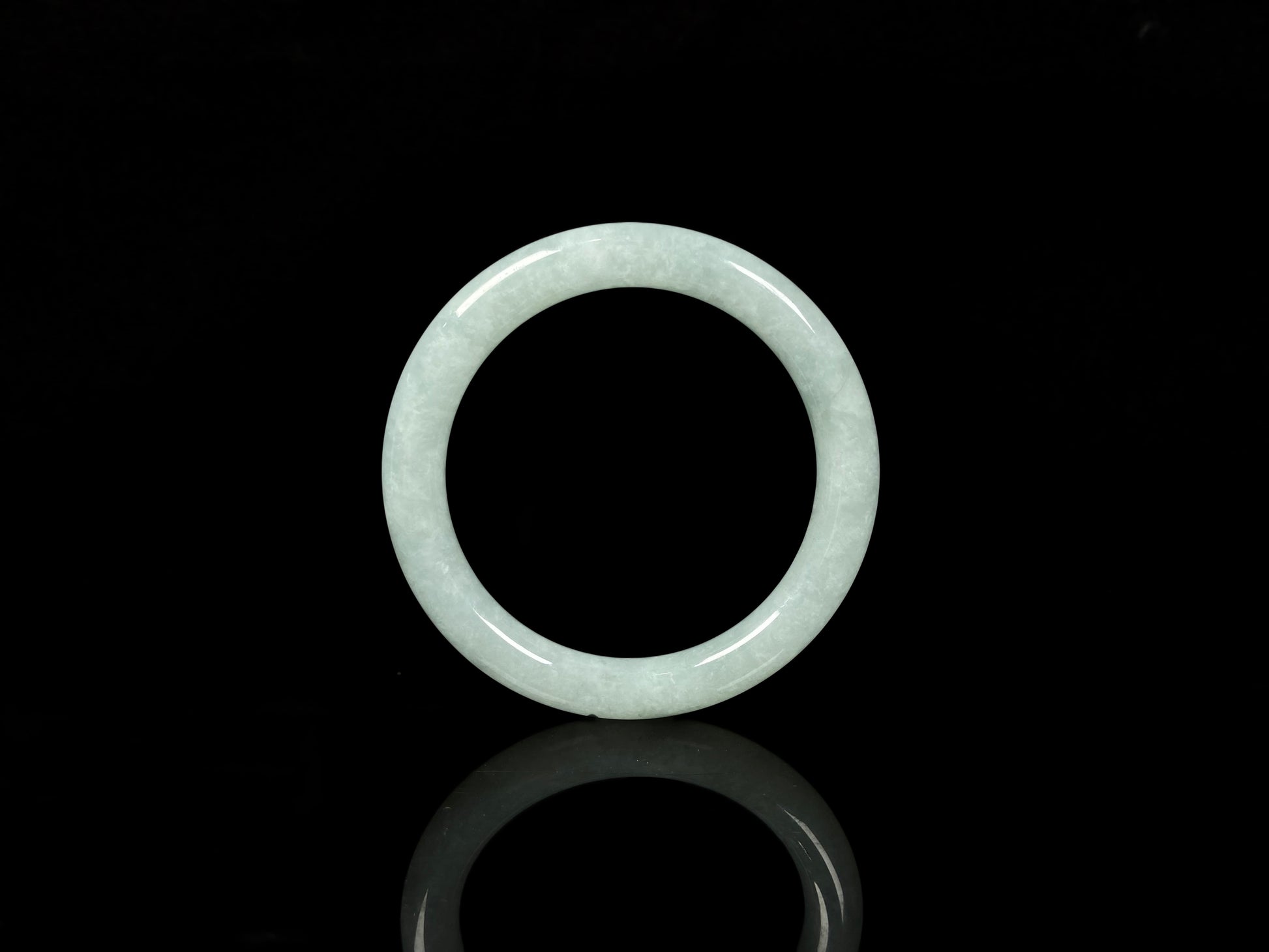 A dewy green jadeite bangle.