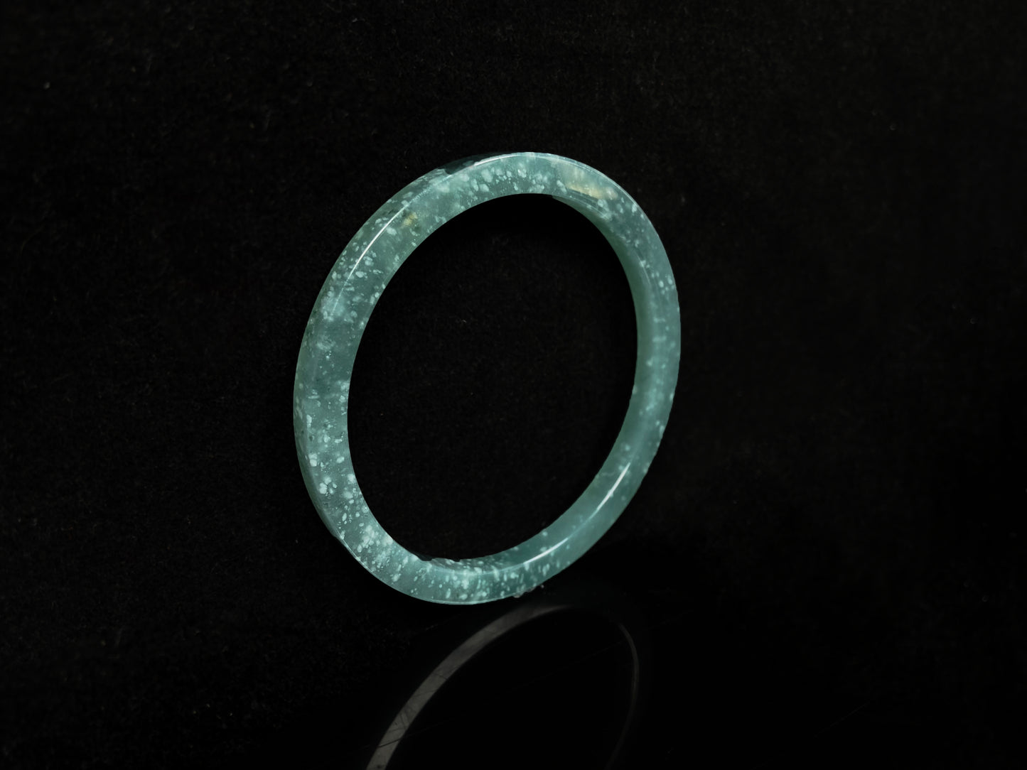 A frosted cyan sparkle jadeite bangle.