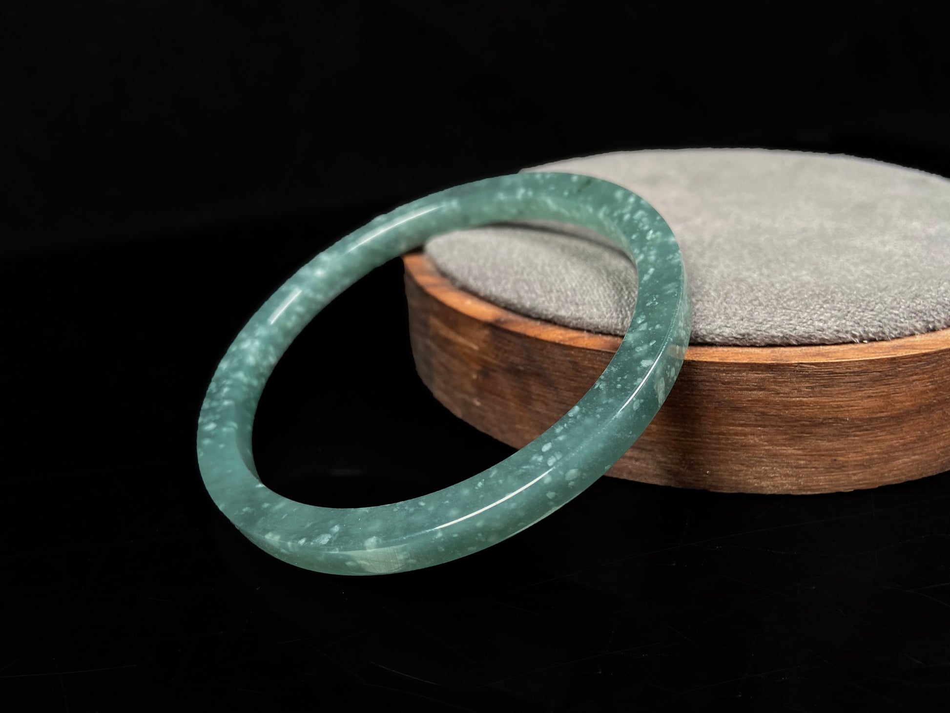 A frosted cyan sparkle jadeite bangle.