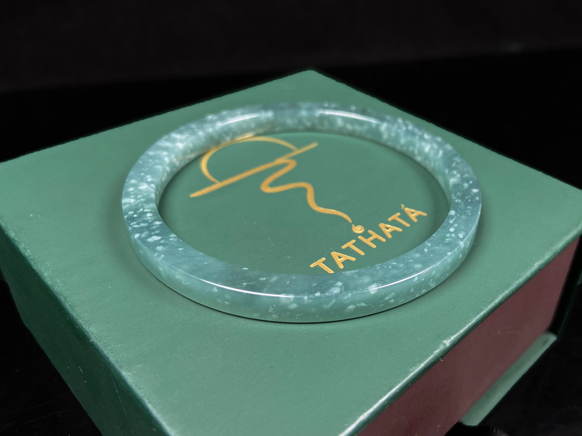 A frosted cyan sparkle jadeite bangle.