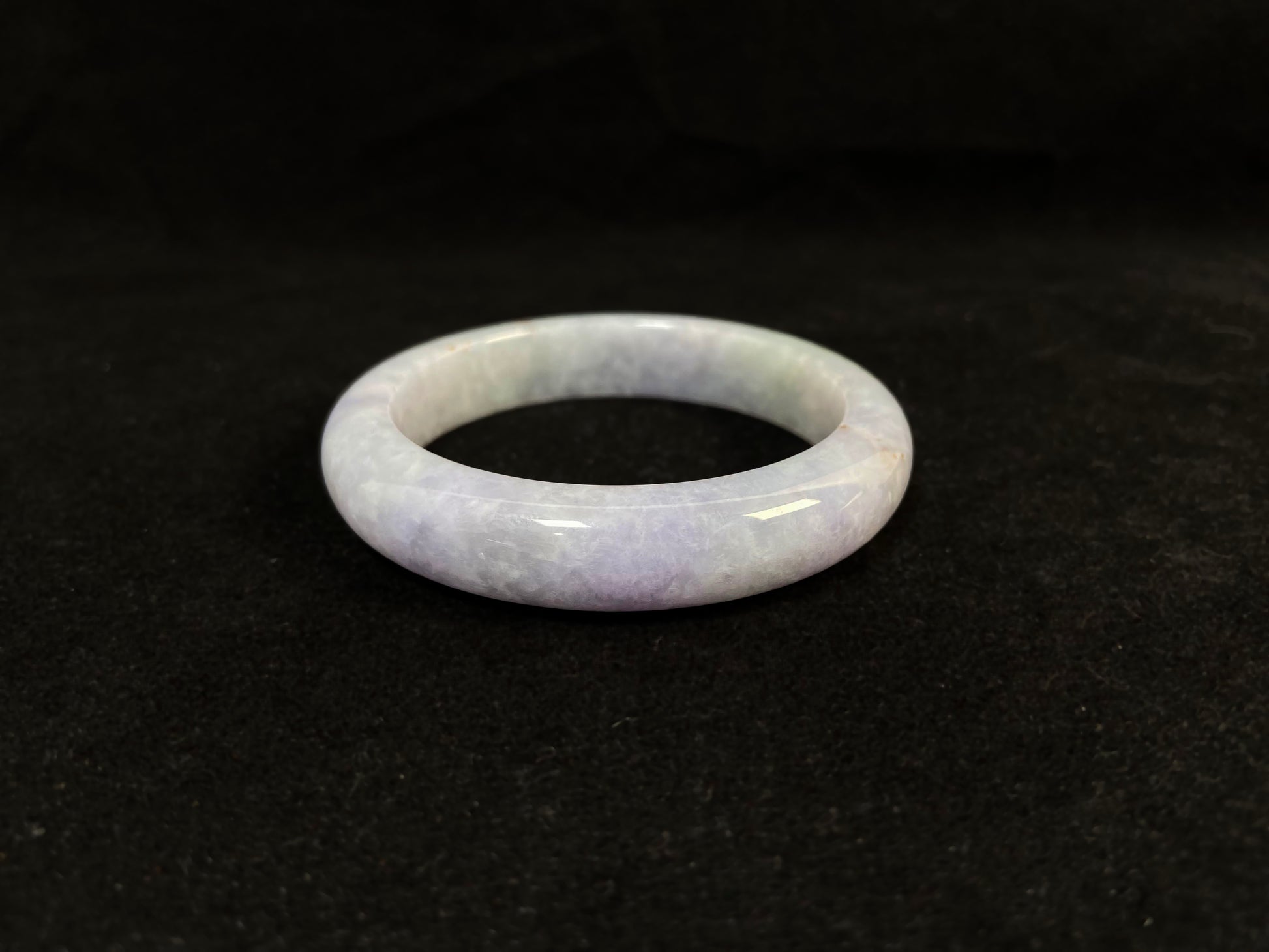 Pale purple jade gracefully mingled with white.