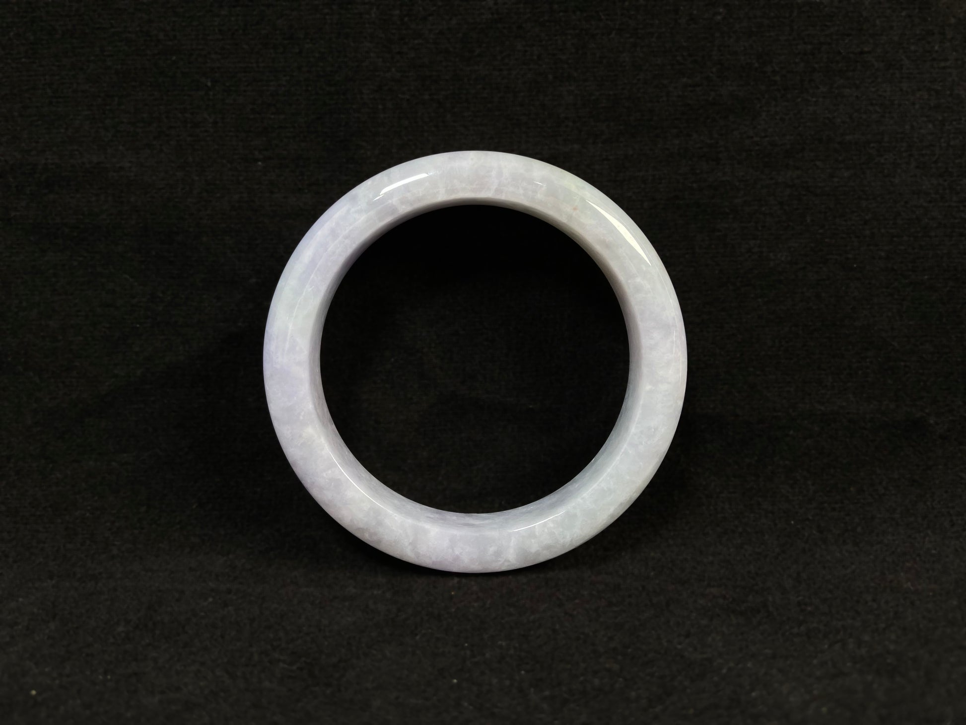 Pale purple jade gracefully mingled with white.