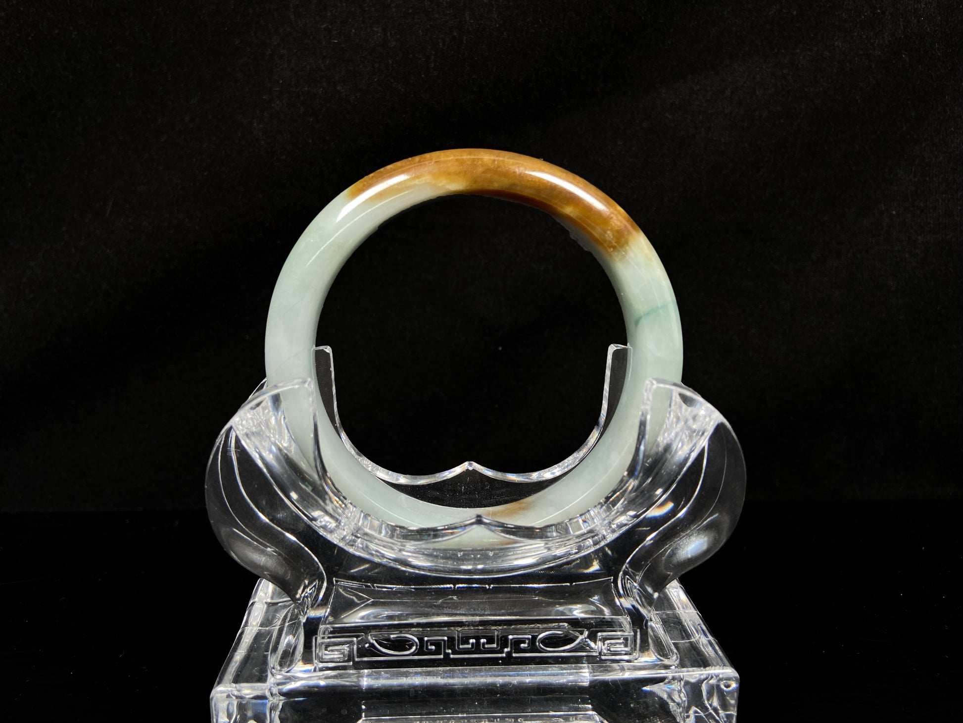 A sunset caramel jadeite bangle.