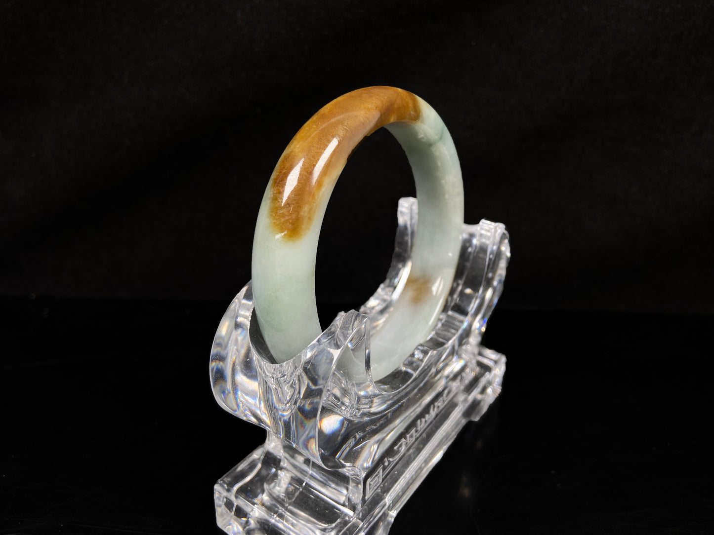 A sunset caramel jadeite bangle.