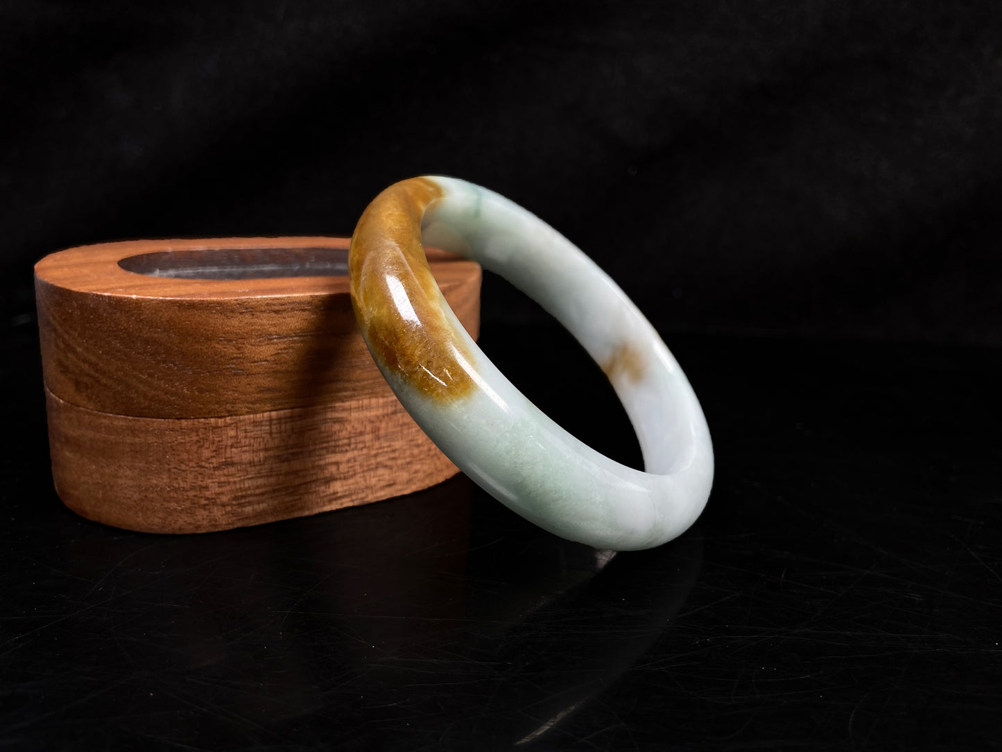 A sunset caramel jadeite bangle.