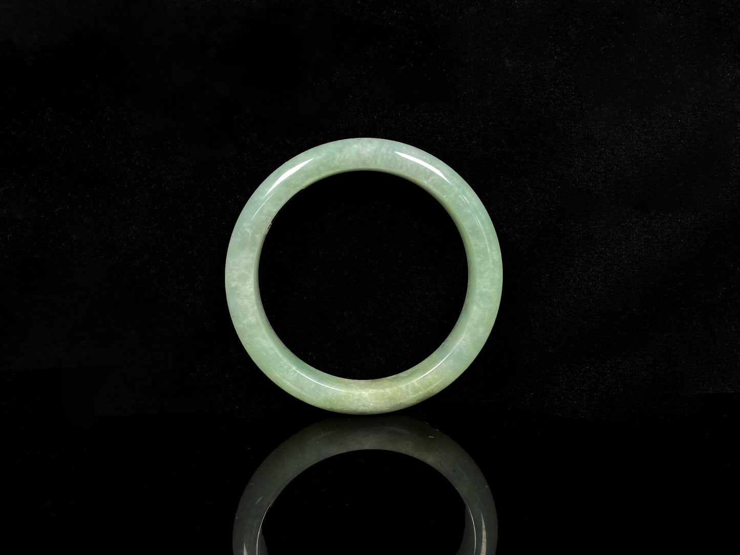 A willow bud green glow jadeite bangle.