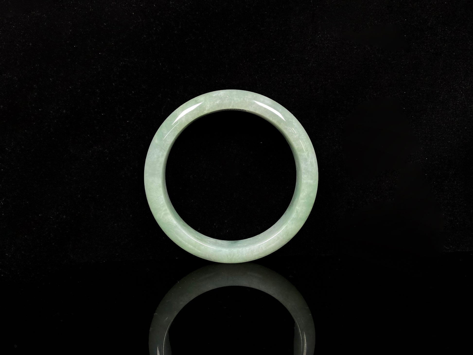 A willow bud green glow jadeite bangle.