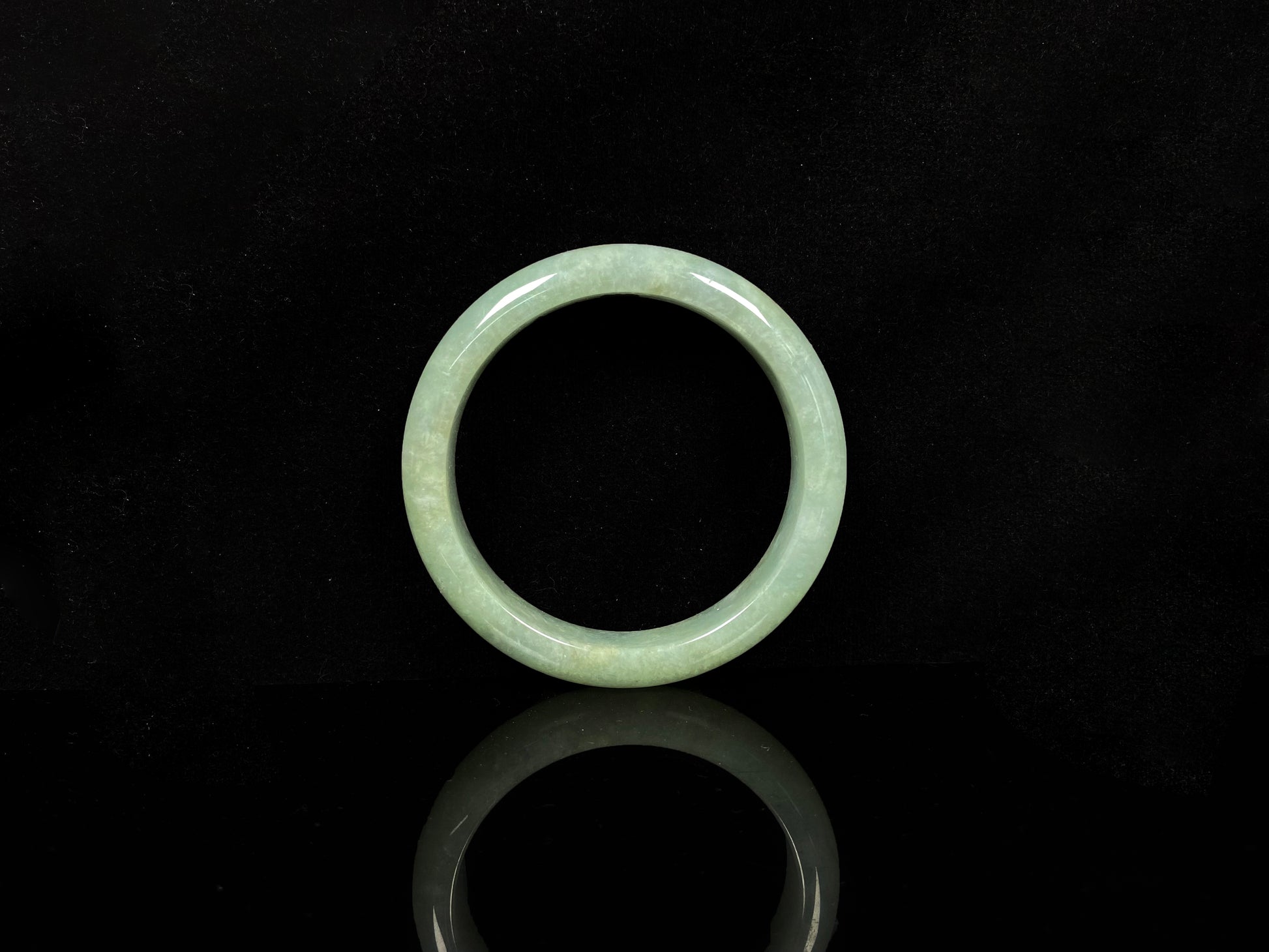 A willow bud green glow jadeite bangle.