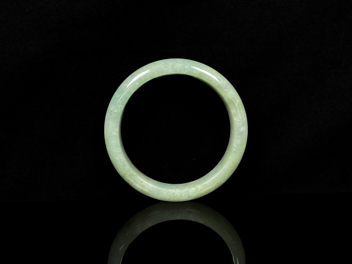 A willow bud green glow jadeite bangle.