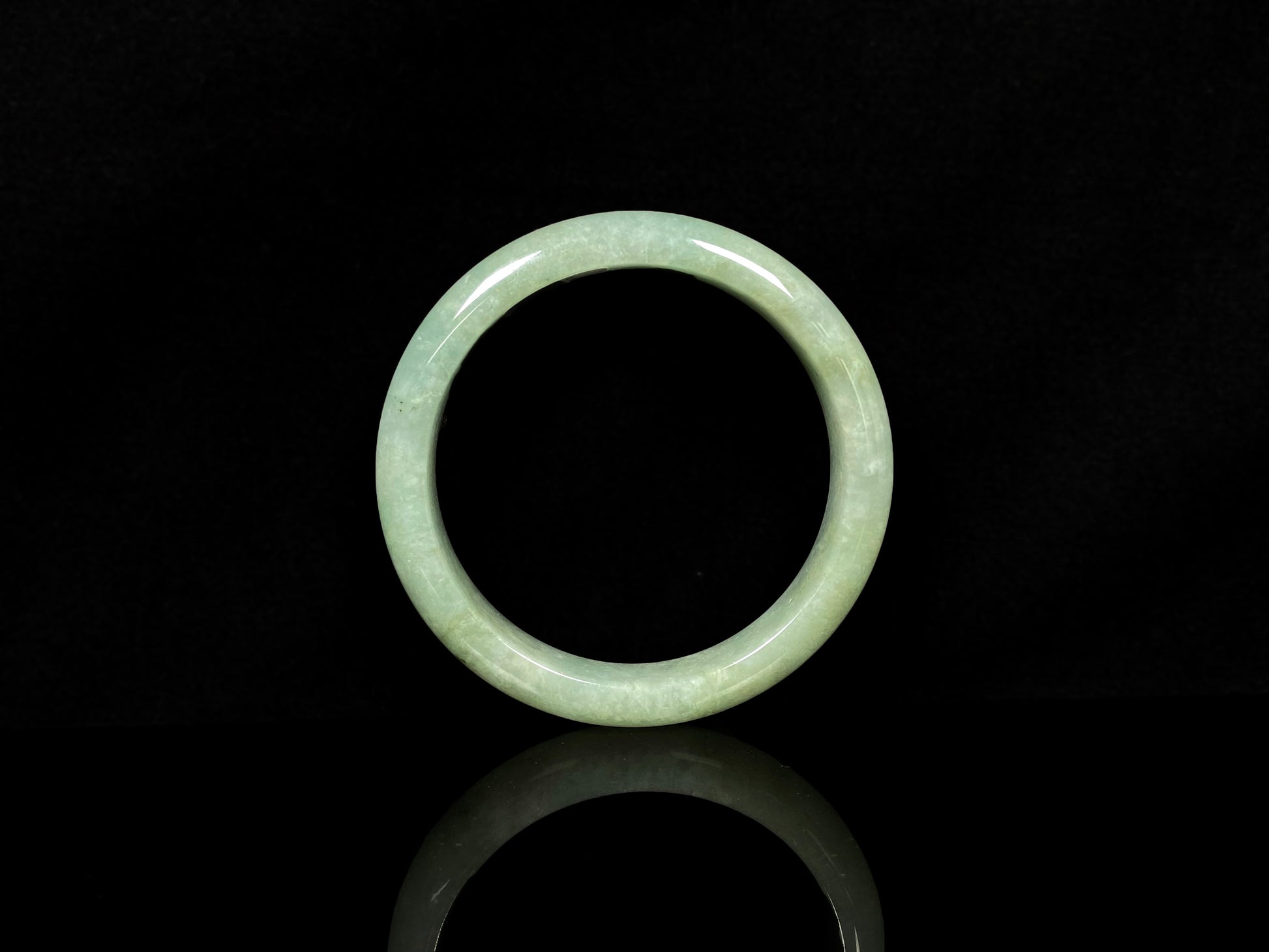 A willow bud green glow jadeite bangle.
