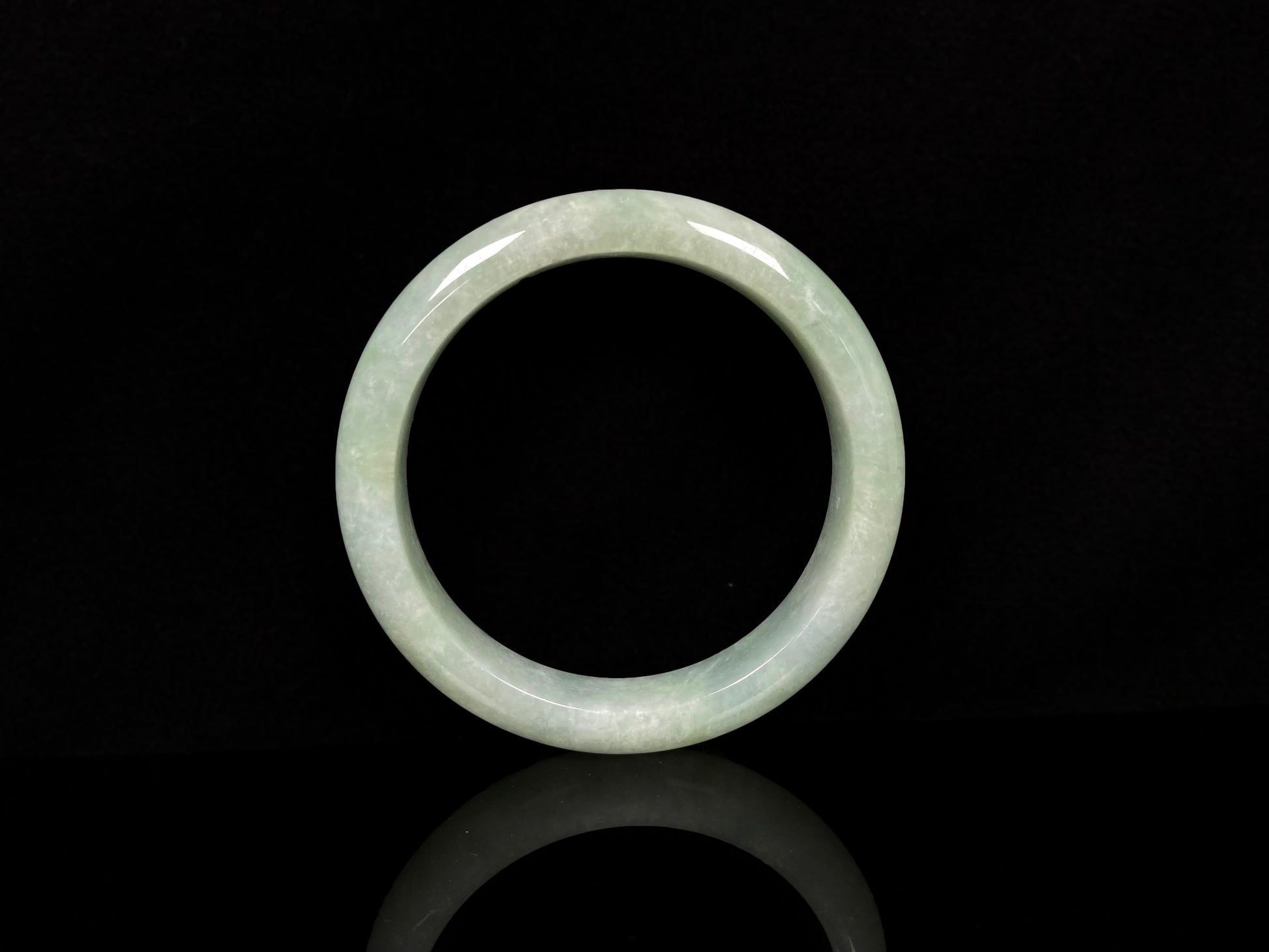 A willow bud green glow jadeite bangle.