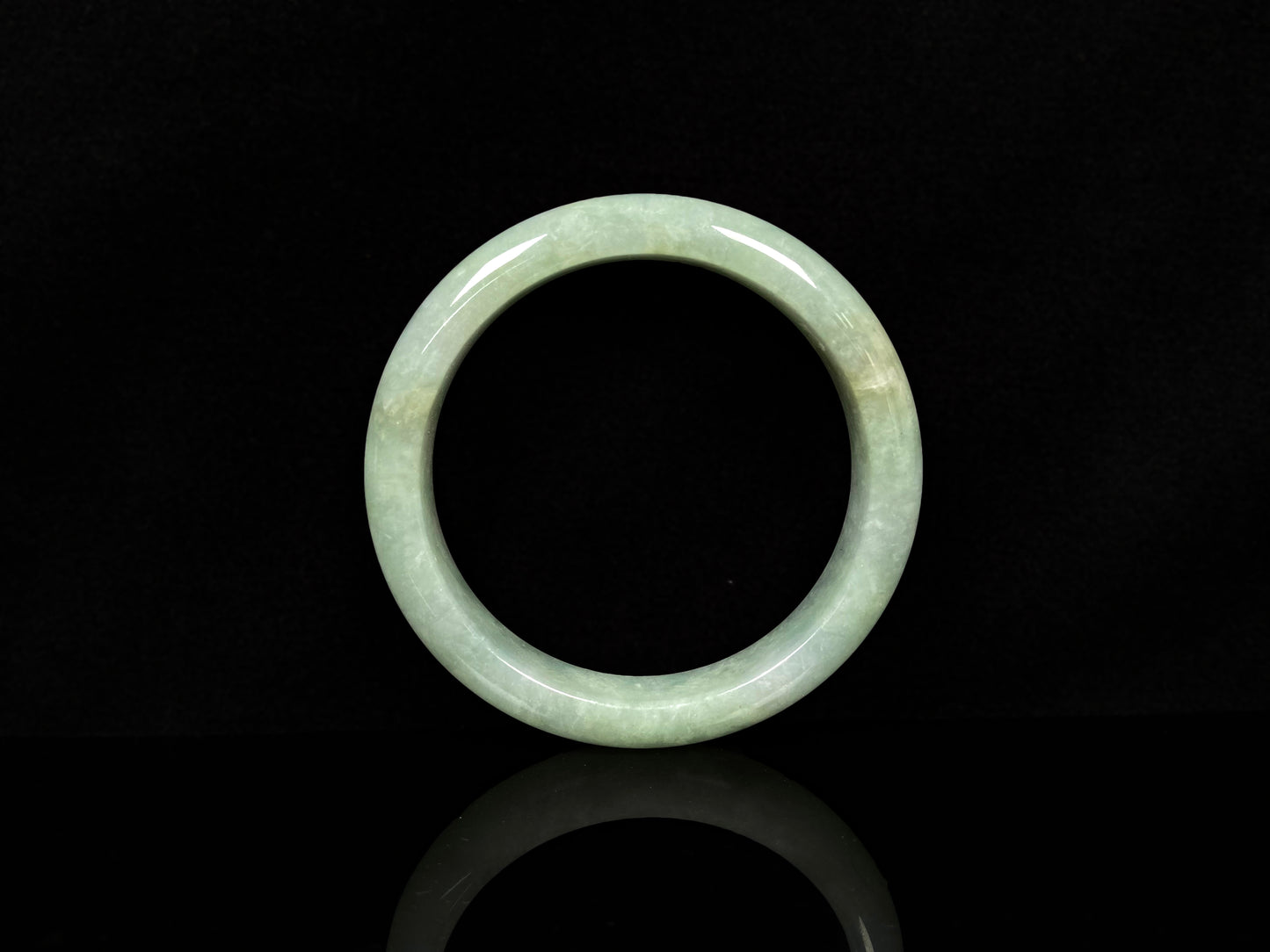 A willow bud green glow jadeite bangle.