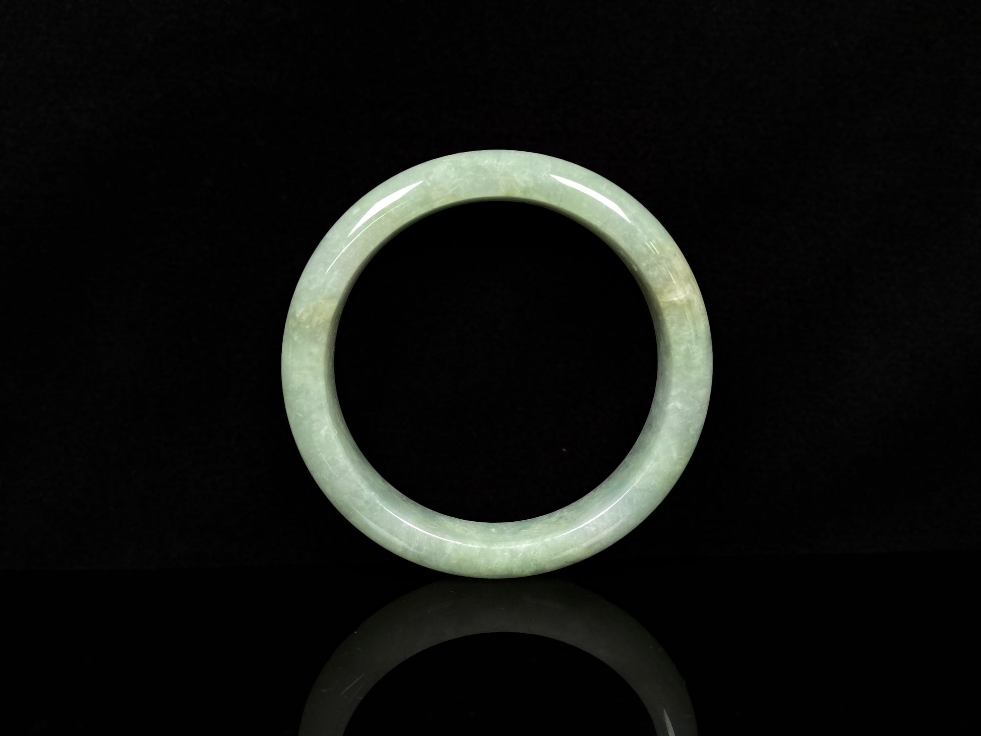 A willow bud green glow jadeite bangle.
