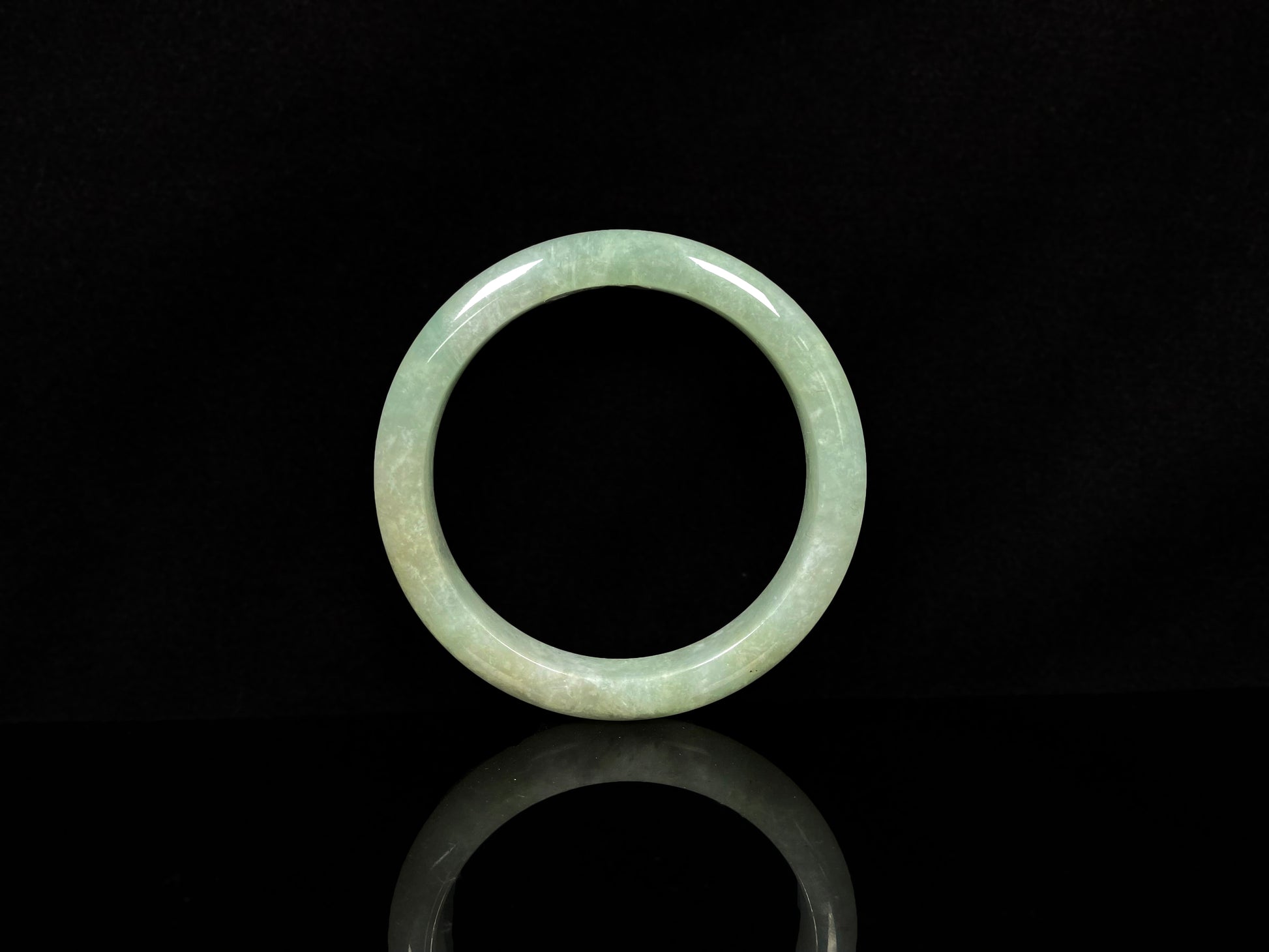 A willow bud green glow jadeite bangle.