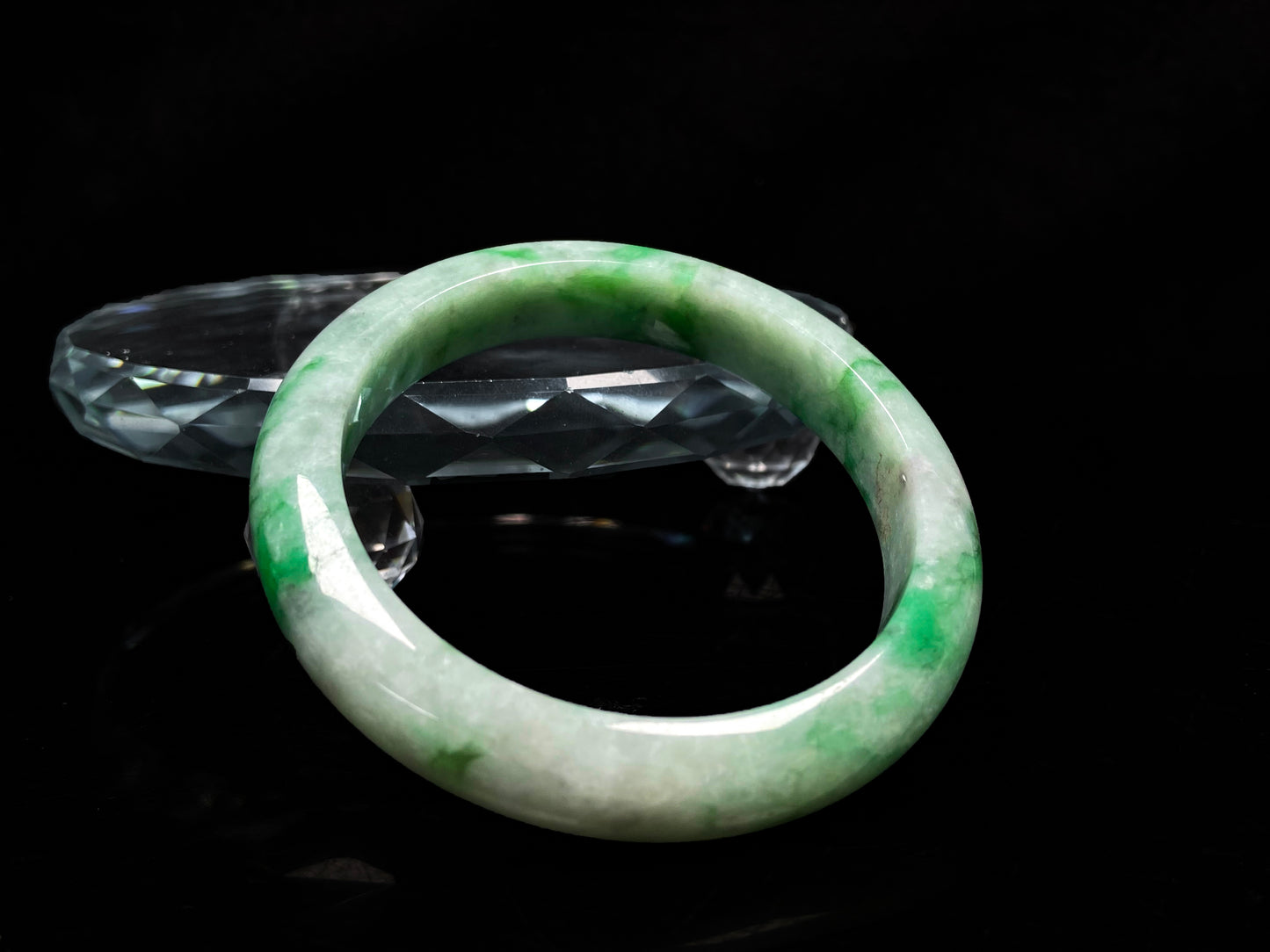 A misty bamboo green jadeite bangle.