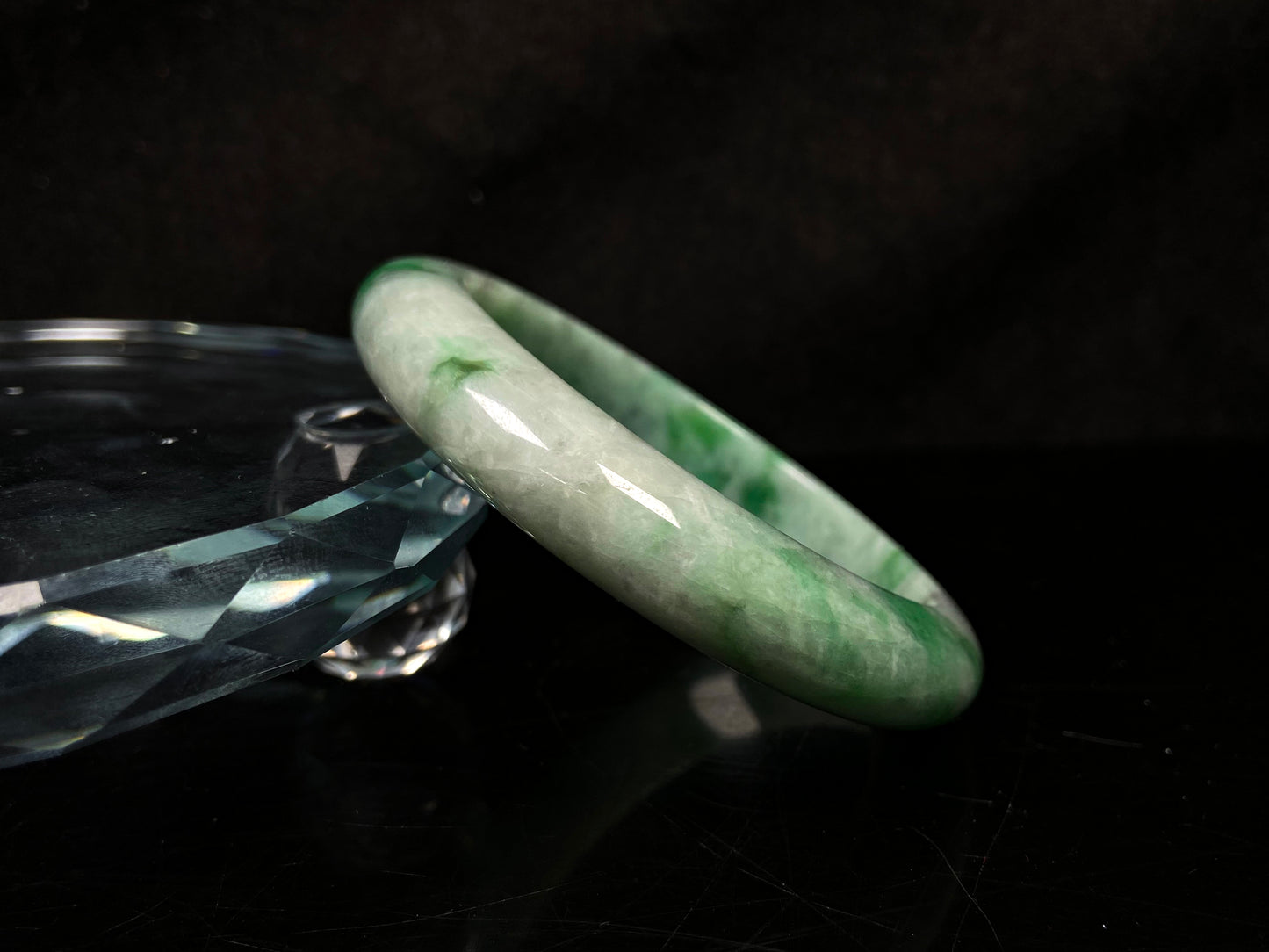 A misty bamboo green jadeite bangle.