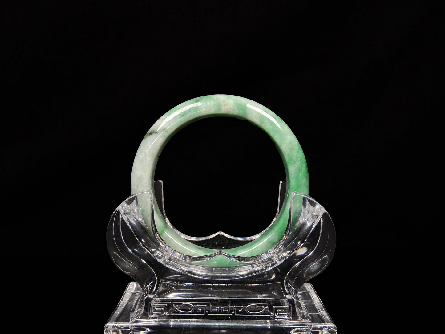 A green white jadeite bangle.