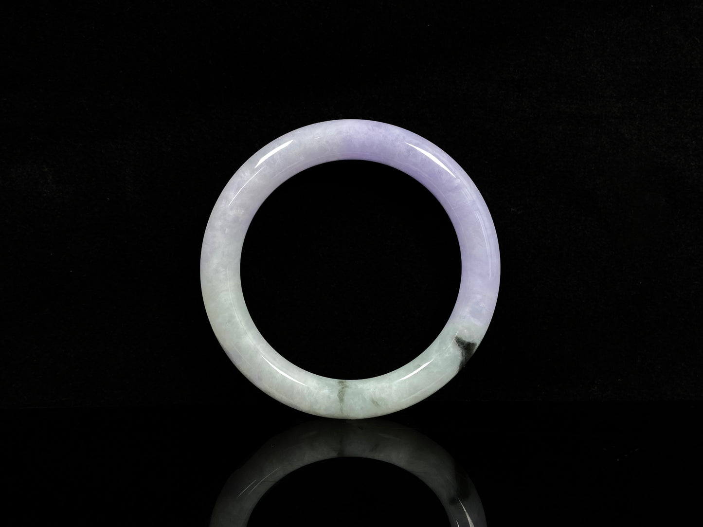 A half lavender half pale green jadeite bangle.
