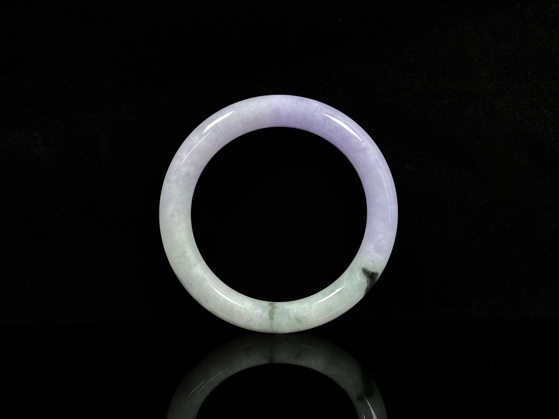 A half lavender half pale green jadeite bangle.