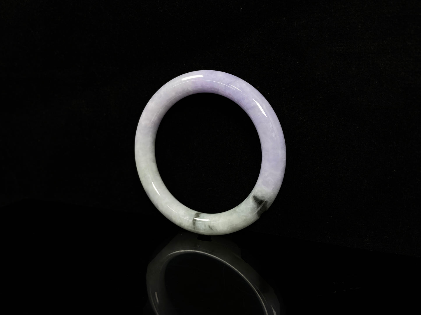 A half lavender half pale green jadeite bangle.