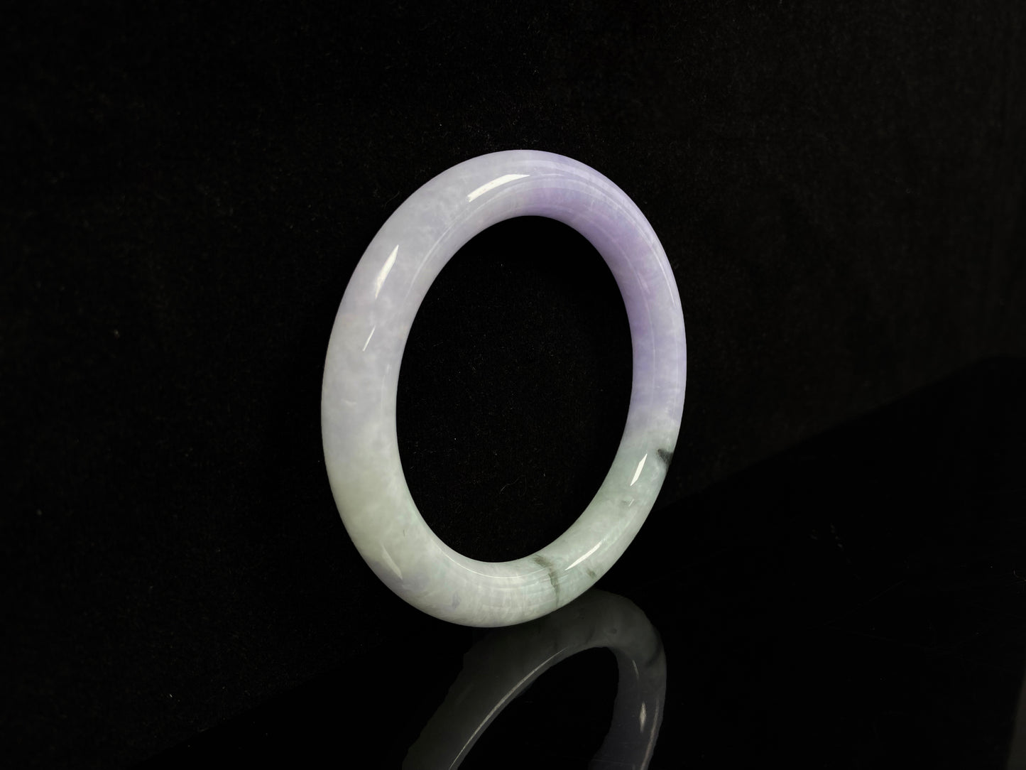 A half lavender half pale green jadeite bangle.