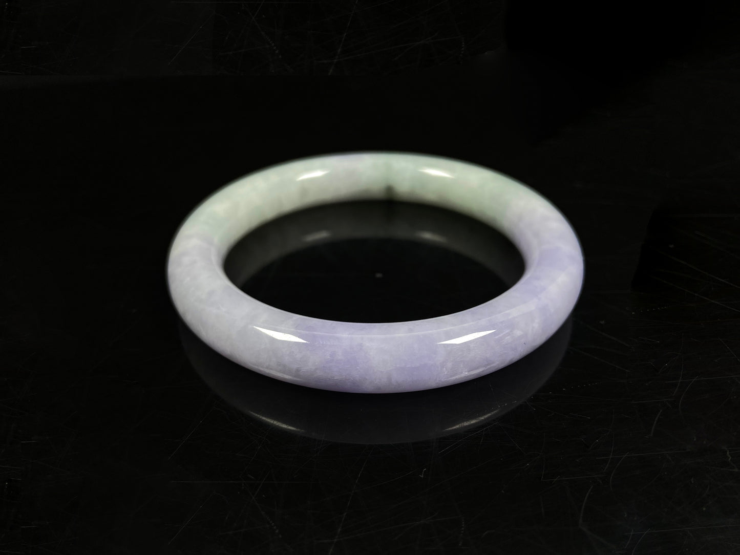 A half lavender half pale green jadeite bangle.
