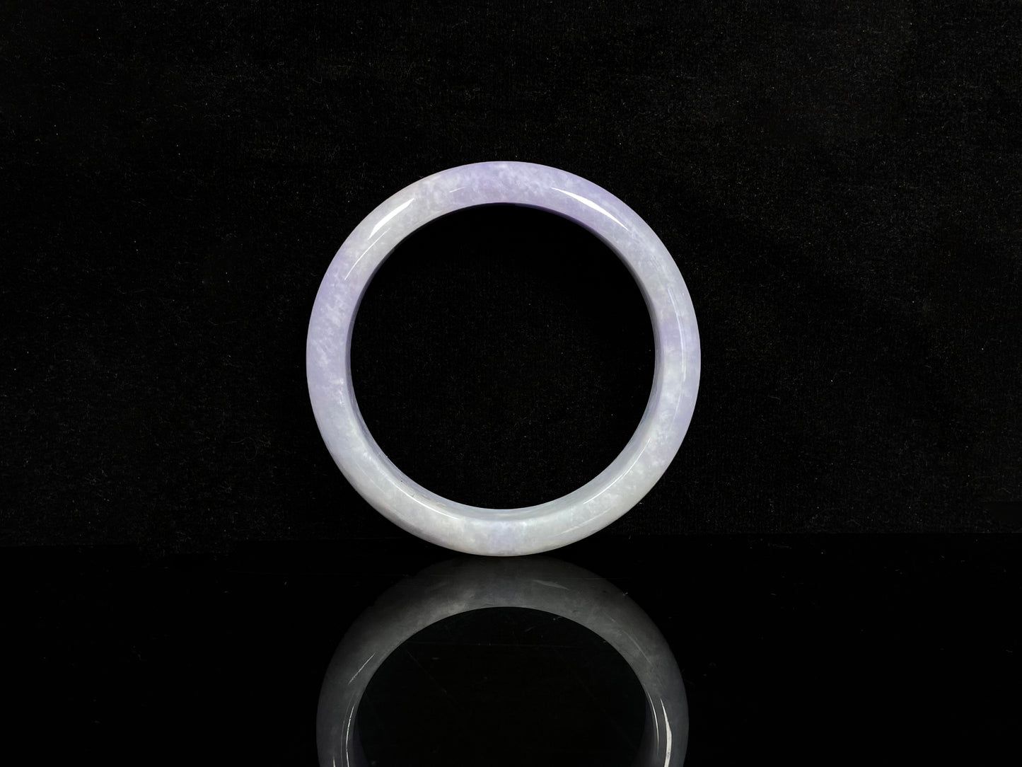 A lilac haze white jadeite bangle.