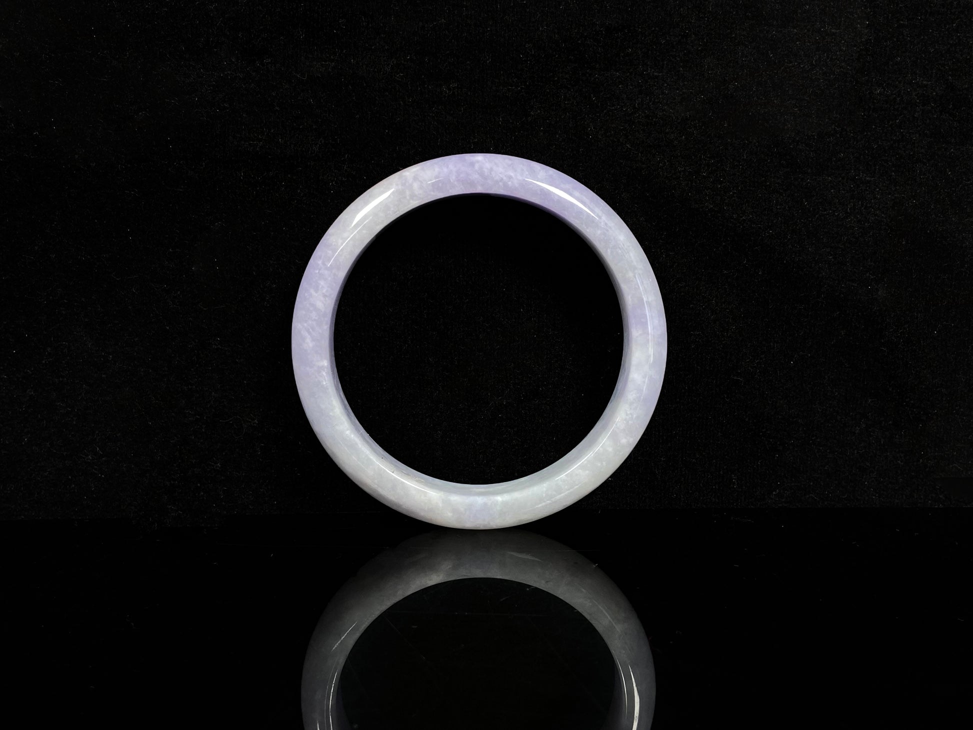 A lilac haze white jadeite bangle.