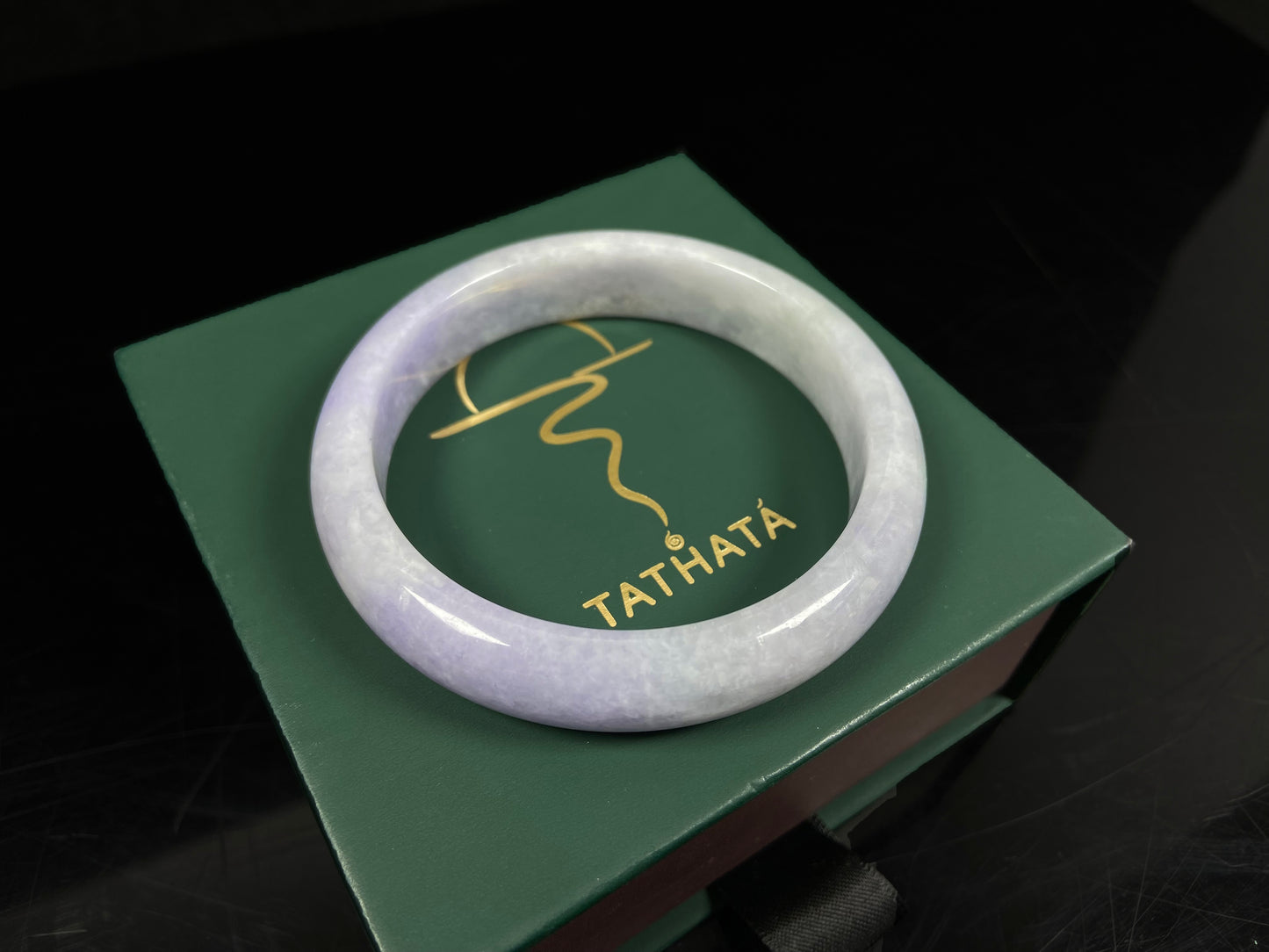 A lilac haze white jadeite bangle.