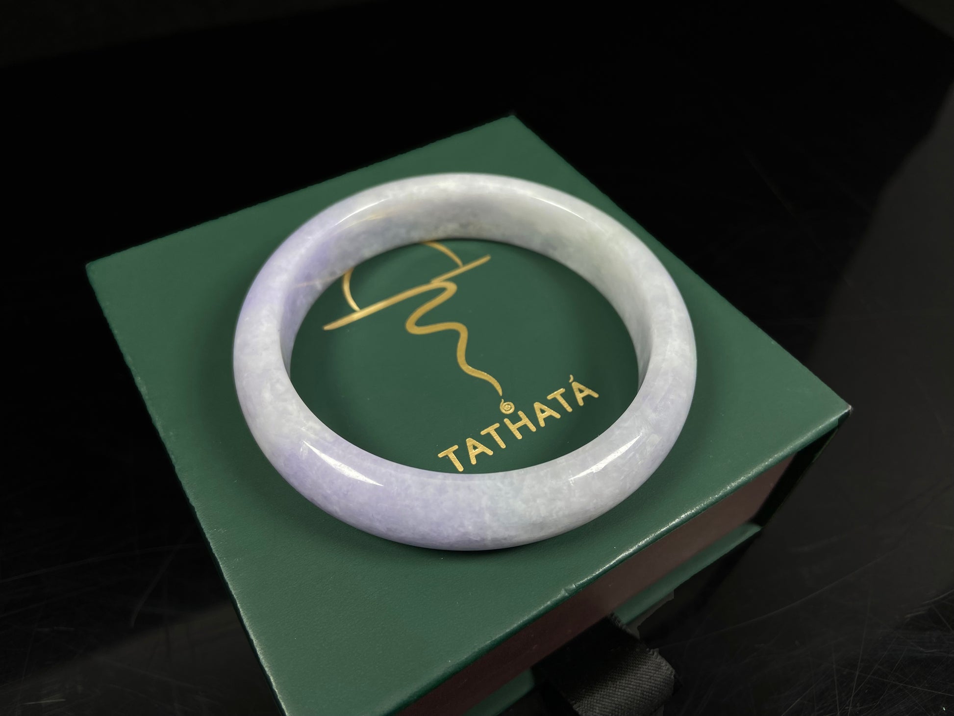 A lilac haze white jadeite bangle.