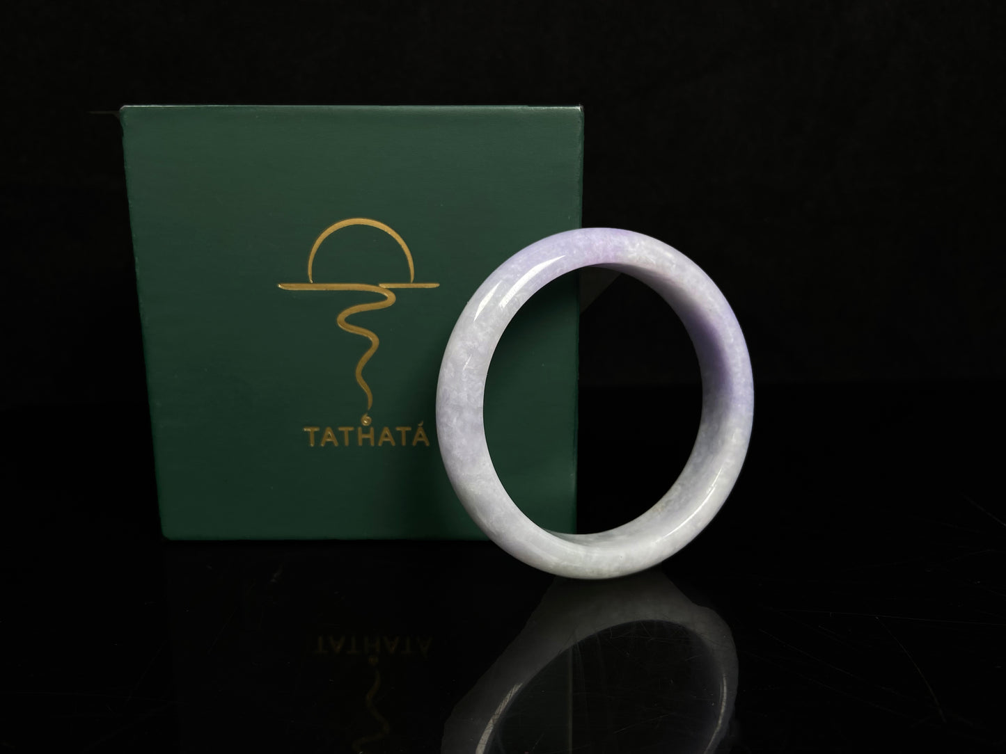 A lilac haze white jadeite bangle.