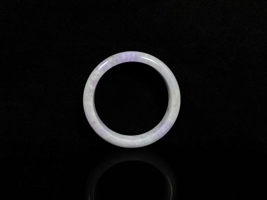 A milky green white base with soft lavender veins jadeite bangle.
