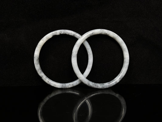 A gray white cloud haze pair jadeite bangle.