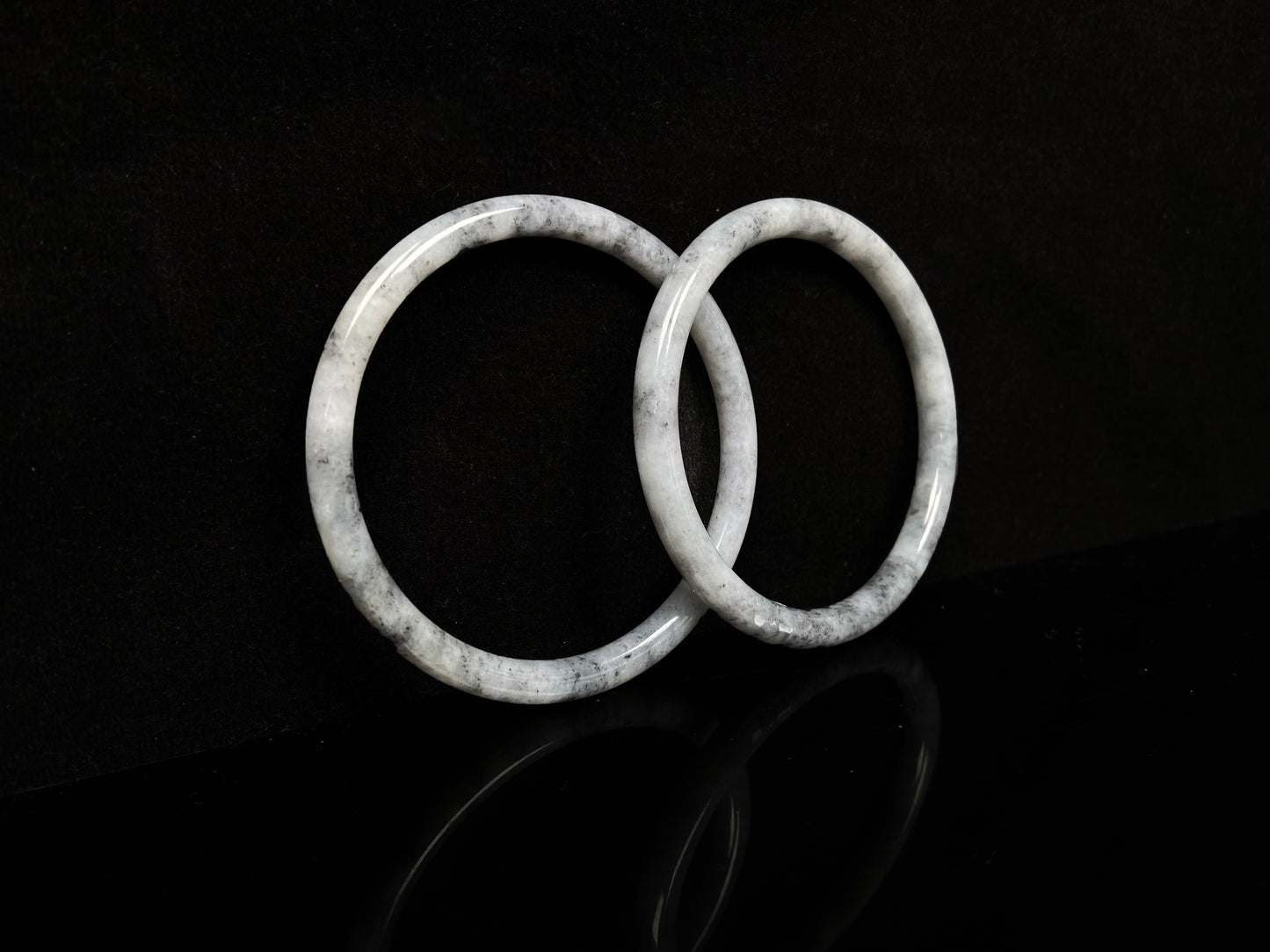 A gray white cloud haze pair jadeite bangle.