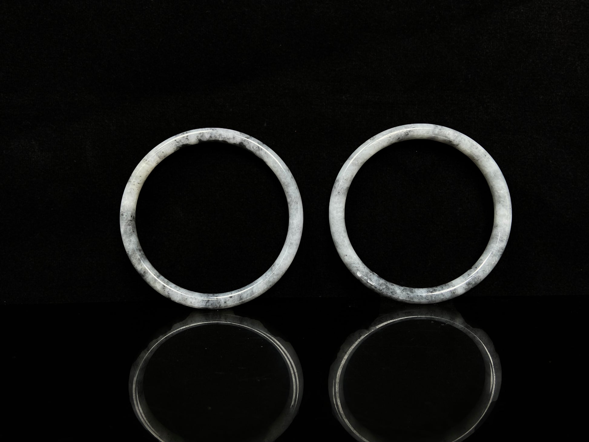 A gray white cloud haze pair jadeite bangle.