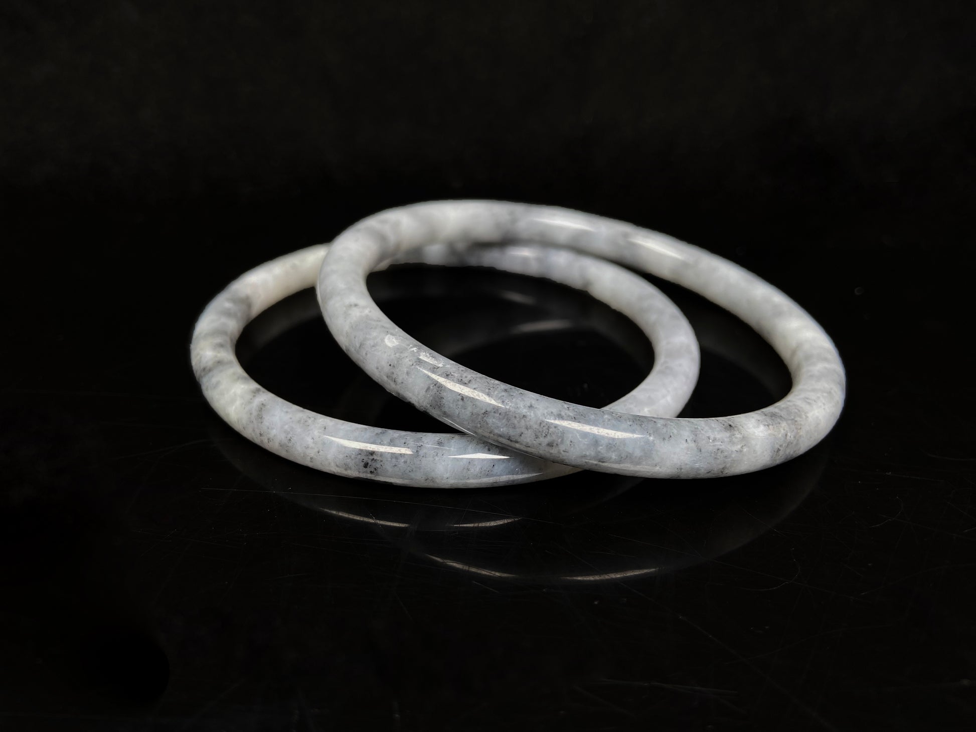 A gray white cloud haze pair jadeite bangle.