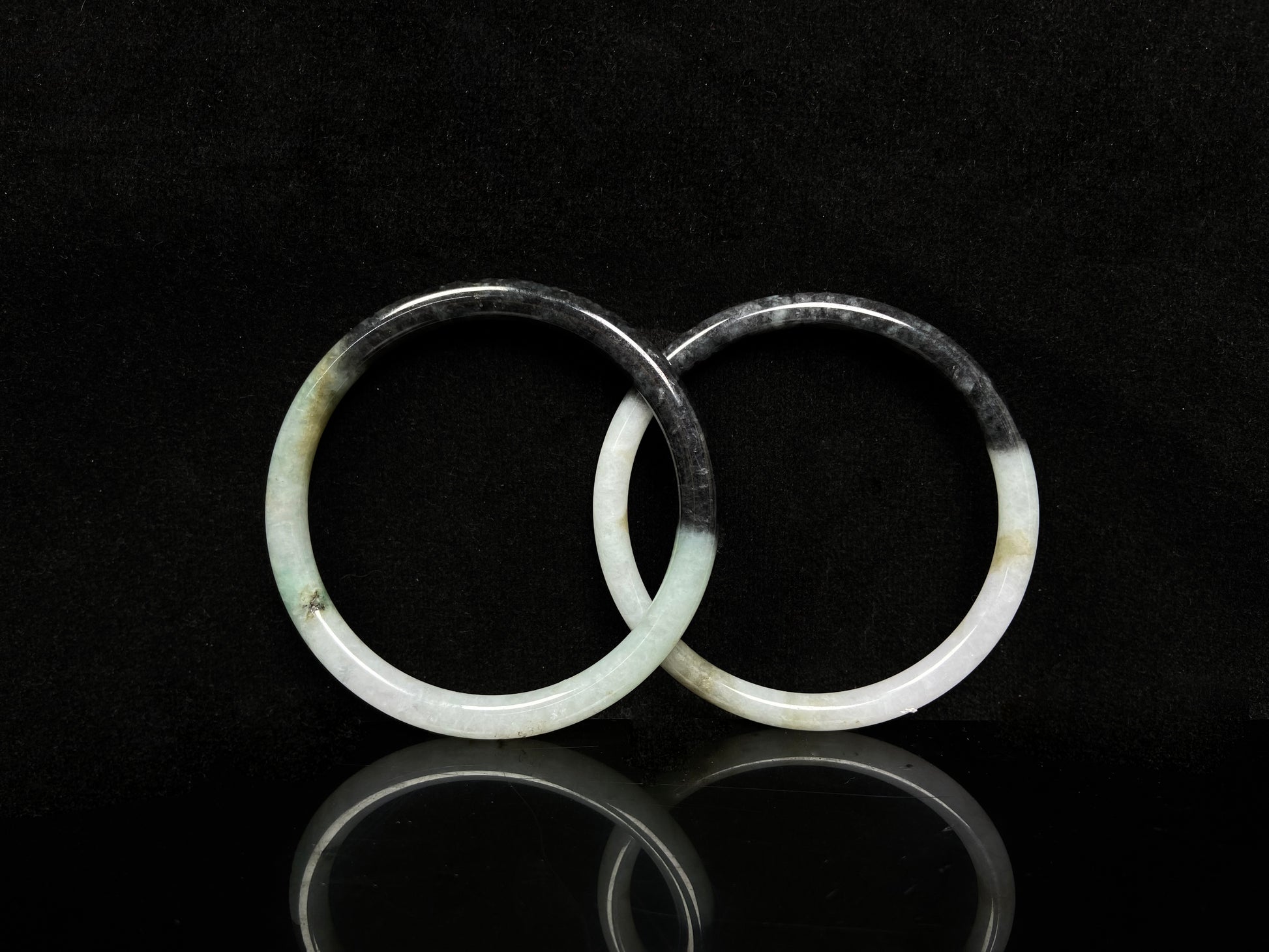 A tri color gradient haze pair jadeite bangle.