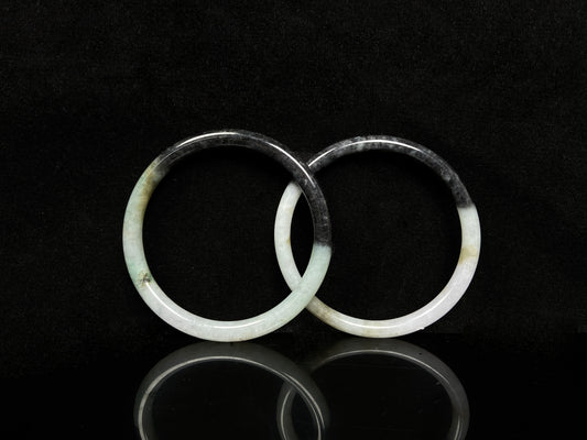 A tri color gradient haze pair jadeite bangle.