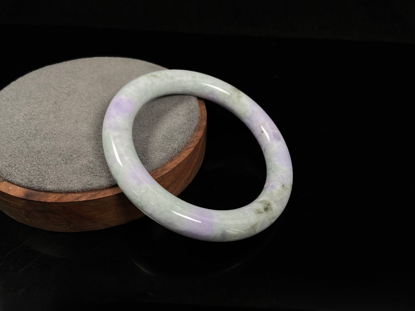 A intermingled green and lavender purple jadeite bangle.