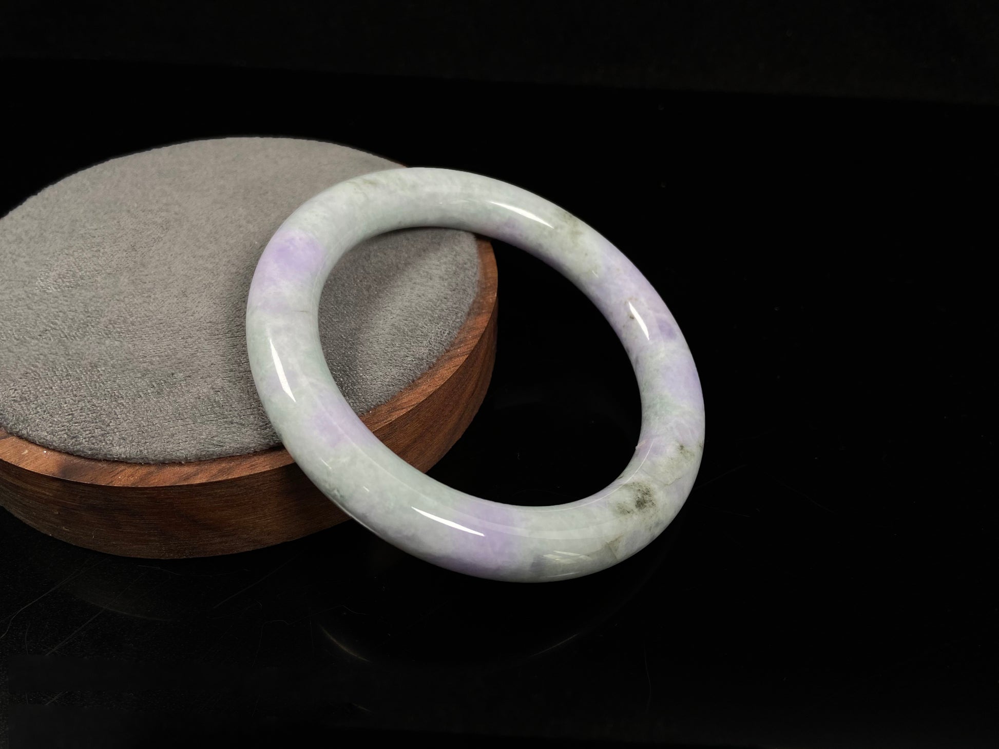 A intermingled green and lavender purple jadeite bangle.